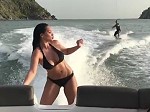 Beautiful Bikini Girl Dancing On The Back Of A Boat
