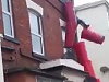 Dumbass Tries To Climb A Building And Comes Crashing Down