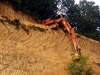 Excavator Takes The Lazy Way Down