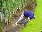 Golfer Succumbs To The Water Hazard
