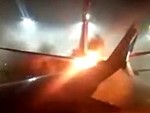 Horrified Passengers Watch A Burning Plane On The Tarmac
