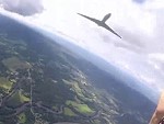 Parachutist Almost Taken Out By A Passing Jet Airplane
