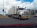 Semi Blows Through An Intersection And Almost Flattens A Car
