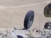 Soldiers Let A Tyre Go Down A Mountain
