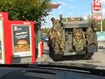 Soldiers Take Their Tank Through A Drive Thru

