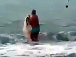 Speedos Guy Walks Into The Ocean With A Net
