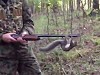 Squirrel Is Having A Great Time On A Hunters Rifle
