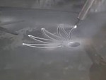 Water Cuts Through A Solid Sheet Of Metal
