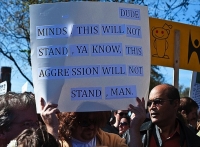 Protester Signs 12