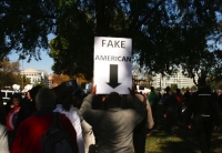 Protester Signs 13