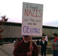 Protester Signs 16