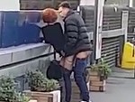 Couple Get The Urge Waiting For A Train To Arrive
