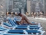 Couple Unashamedly Fuck On A Beach Sunlounge
