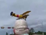 Biplane Gets Friendly With A Billboard
