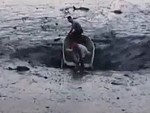 Boat In An Unfortunate Position As A Sinkhole Opens

