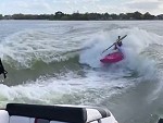 Boats Hook Their Canoe Mate Up With Some Waves
