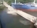 Cargo Ship Steams Right Through A Bridge
