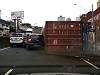 Cargo Truck Spectacularly Rolls Onto The Freeway