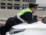 Chinese Cop Is Committed To Giving The Guy A Ticket
