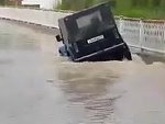 Cocky Dummy Tries To Cross A Flooded Road
