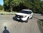 Cop Looking At His Phone Rides Over A Cyclist
