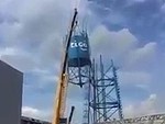 Crane Has Some Trouble Lifting The Water Tower
