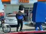 Dominos Standing Over Little Caesars
