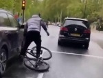 Driver Takes Aim At A Cyclist

