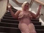 Drunk Blonde Having Her Own Party On The Stairs
