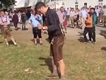 Drunk Guy Is Trying To Get His Shoe On Much To The Delight Of The Crowd
