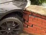 Dumbshit Puts His BMW Z4 Through A Brick Fence
