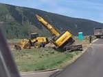 Excavator Makes A Hard Landing Whilst Loading
