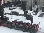 Excavator Operator Helps Get Its Ride Up A Snowy Hill
