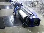 Factory Worker Gets Too Close To The Machine

