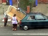 Family Attempts To Transport A Free Couch