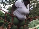 Fat Woman Gets Some Help To Conquer A Rope Wall
