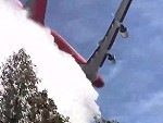 Film Crew Stand Under A Water Bomber As It Drops Its Load
