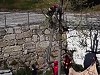 Fire Fighter Not So Gently Helps A Cat Down From A Tree