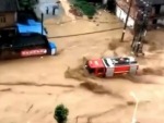 Firetruck Battles A Flood Head On
