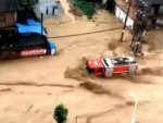 Firetruck Battles A Flood Head On
