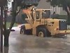 Front End Loader Cleverly Puts Out A Car Fire
