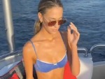 Graceful Blonde On A Boat
