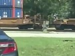 Guy Crosses A Moving Train
