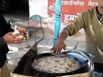 Guy Puts His Bare Hand In Boiling Oil
