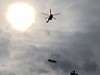 Helicopter Delivering A Pool On A Windy Day