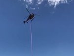 Helicopter Tows A Boat Stranded After The Tide Went Out
