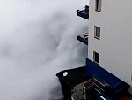 Huge Waves Tear Balconies Off An Apartment Building
