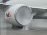 Jet Engine Running On A Wet Runway
