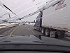 Loose Ice Goes Flying From A Truck Into A Car Windshield
