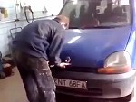 Mechanic Is Having Some Trouble Opening The Hood
